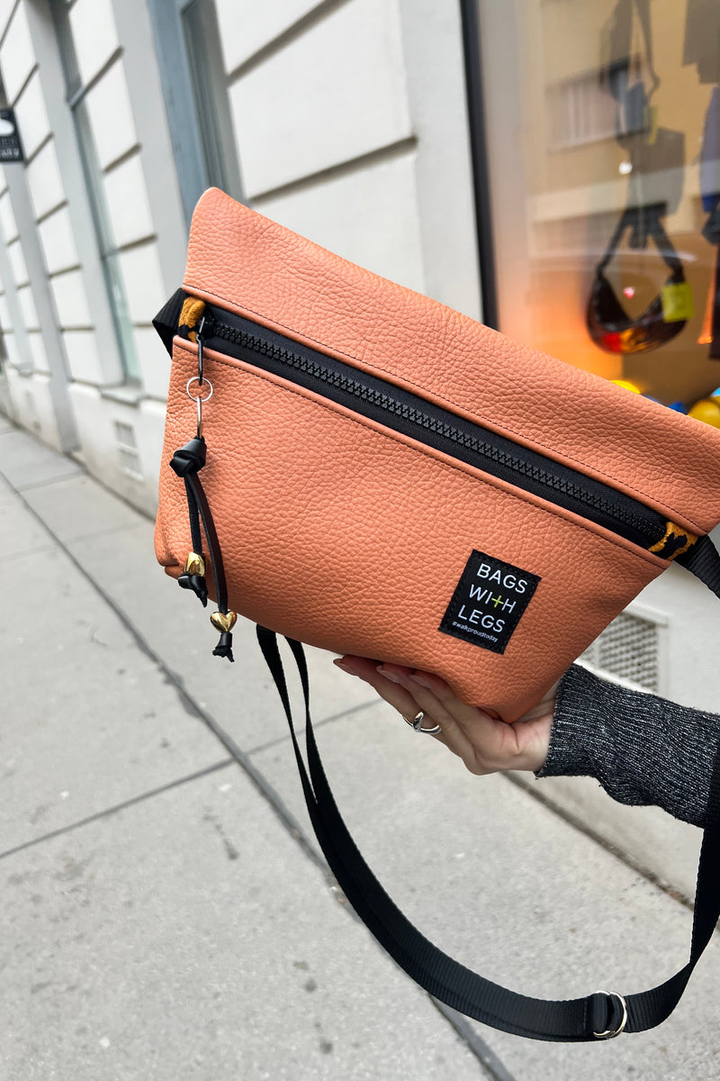 Orange the World crossbody bag worn