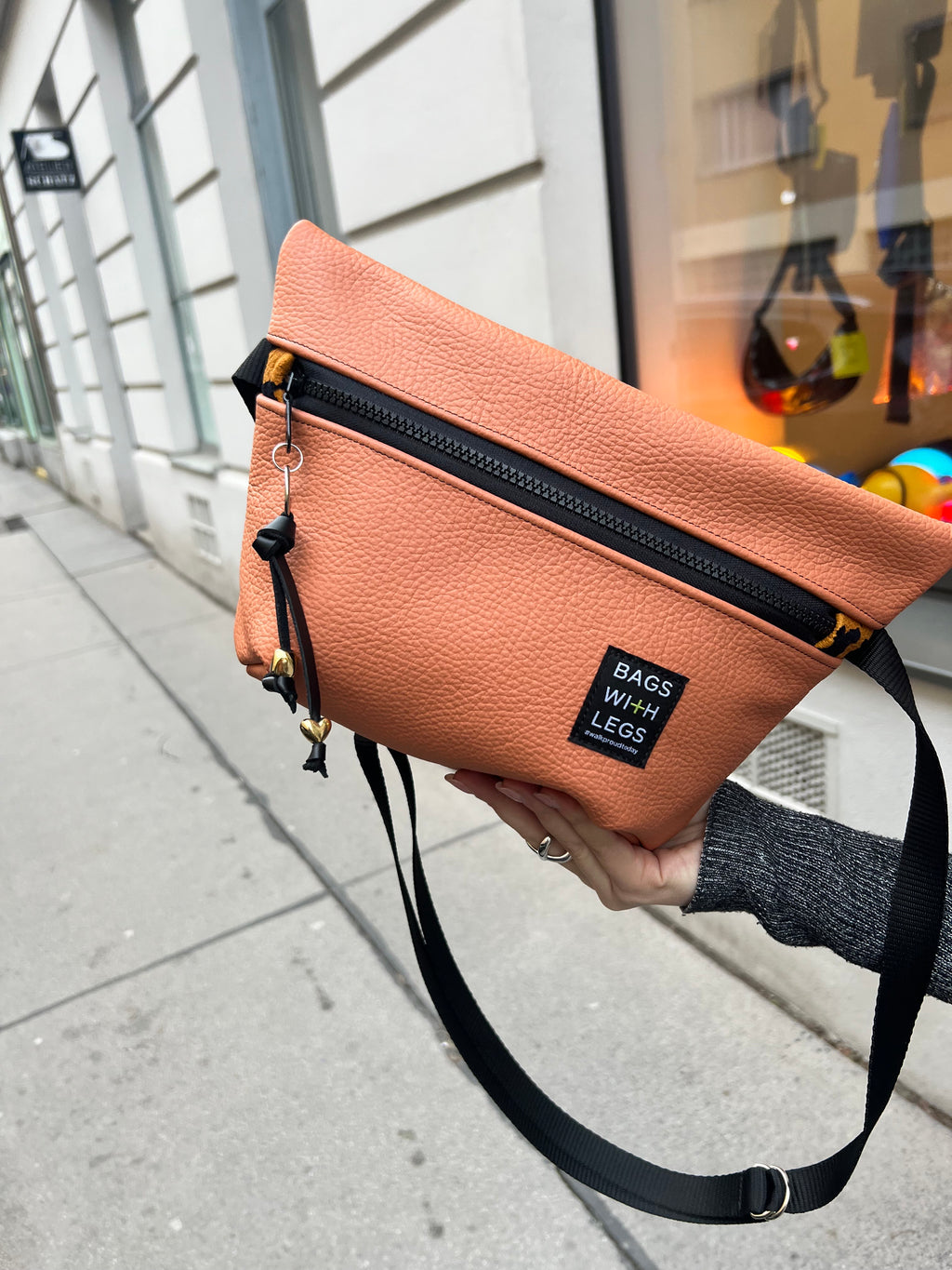 Orange the World crossbody bag worn