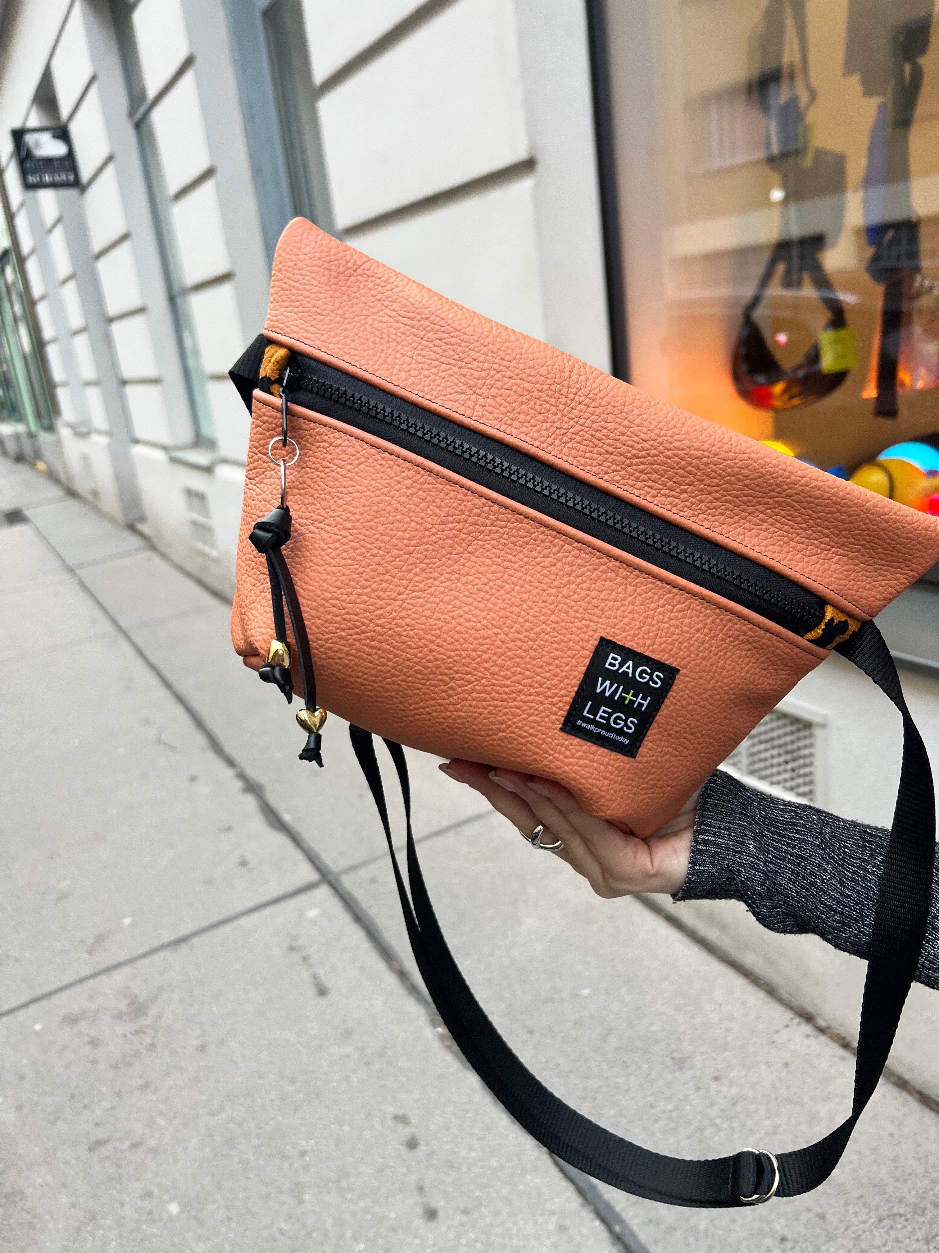 Orange the World crossbody bag worn