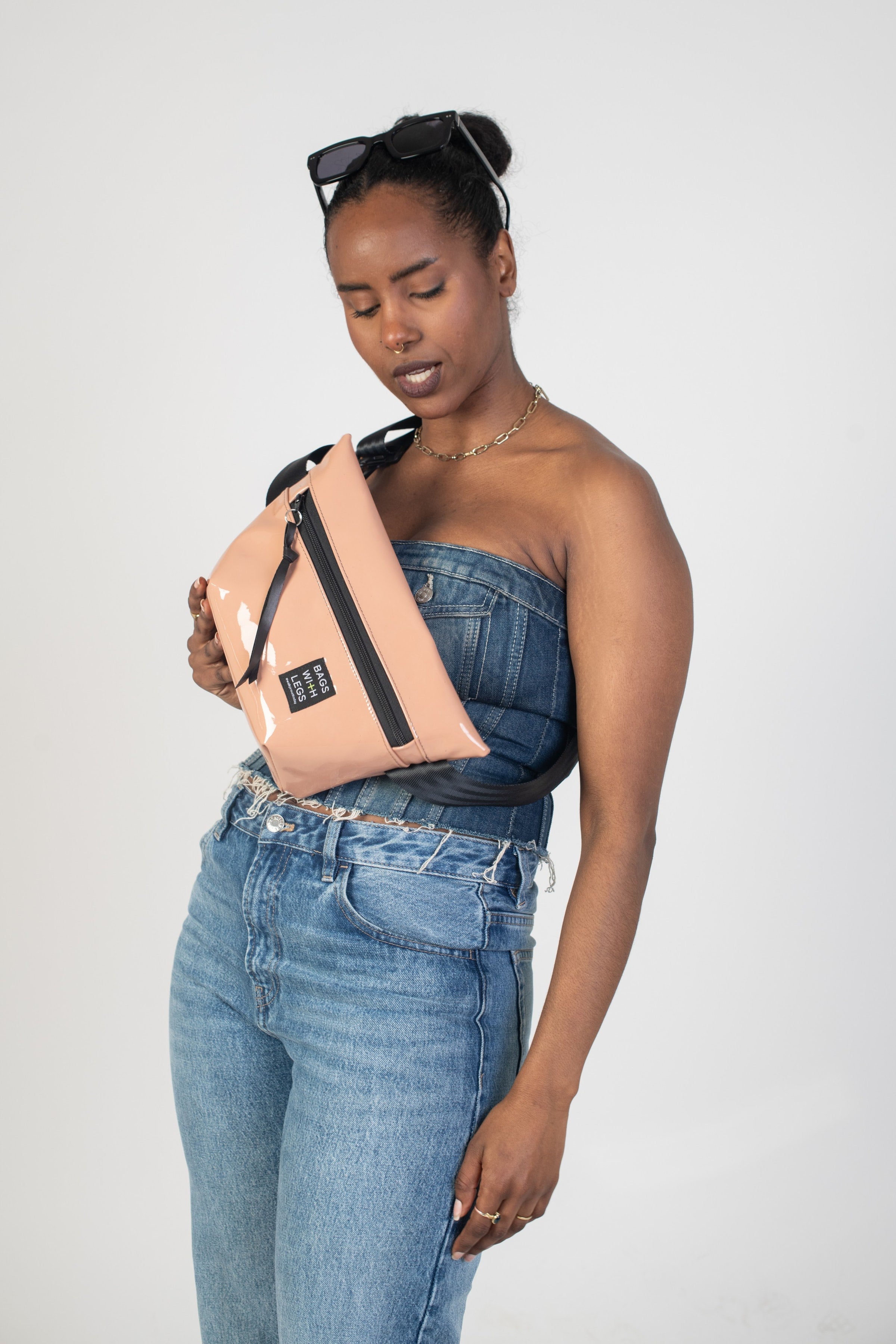 Glossy Beige crossbody bag worn