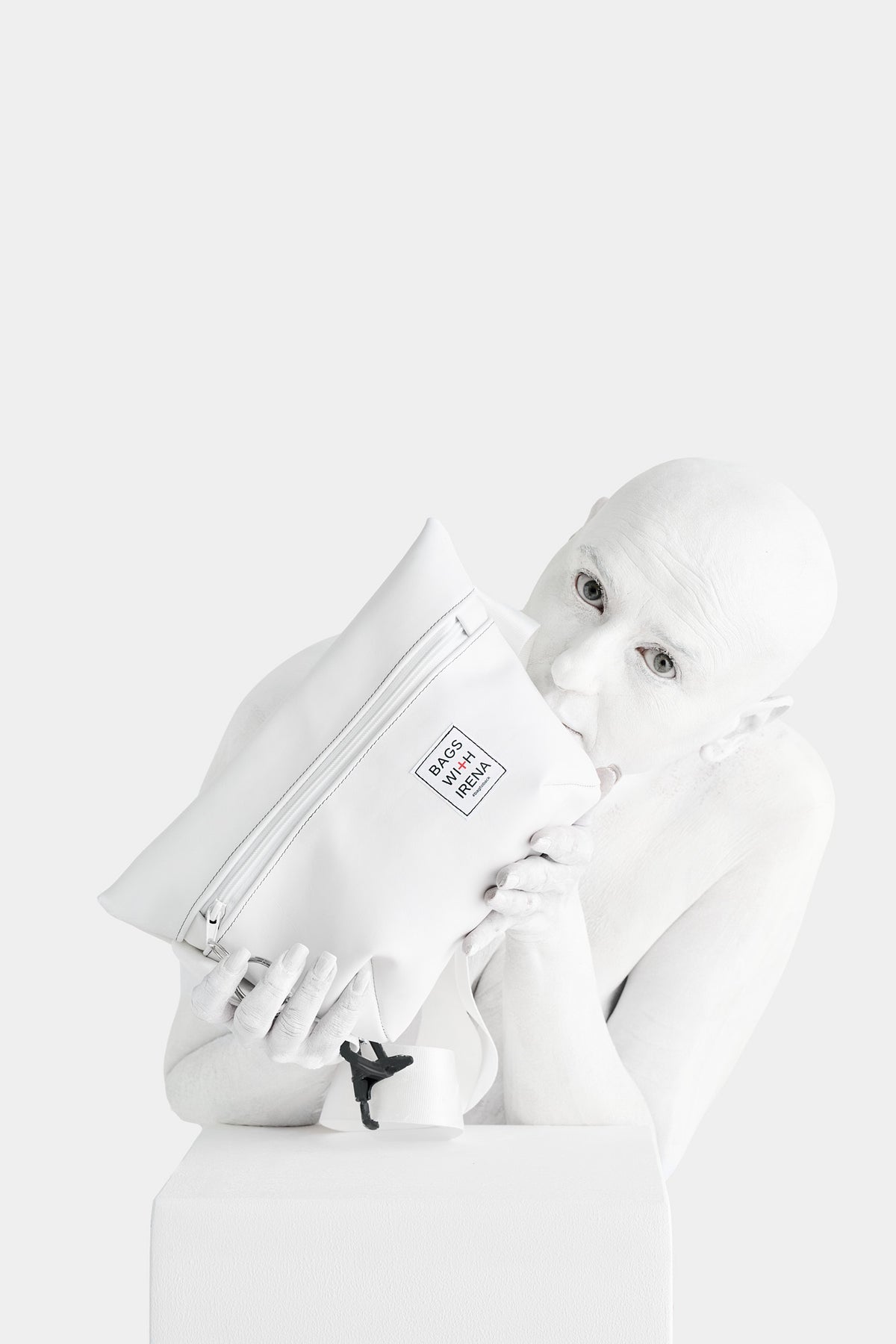 Irena Pejčić resting her head against the white bag