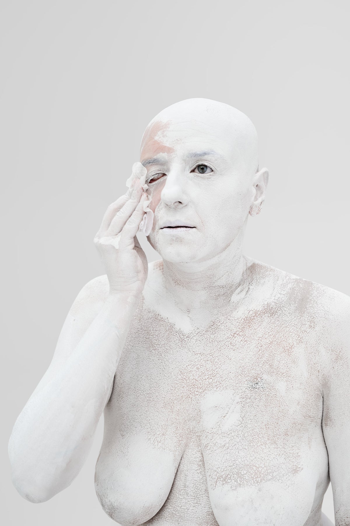 Irena Pejčić wiping the white paint from around her eye
